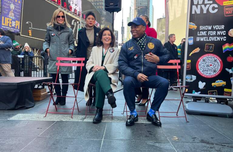 New York Governor Kathy Hochul sits with NYC Mayor Eric Adams at Father Duffy Square in Times Square